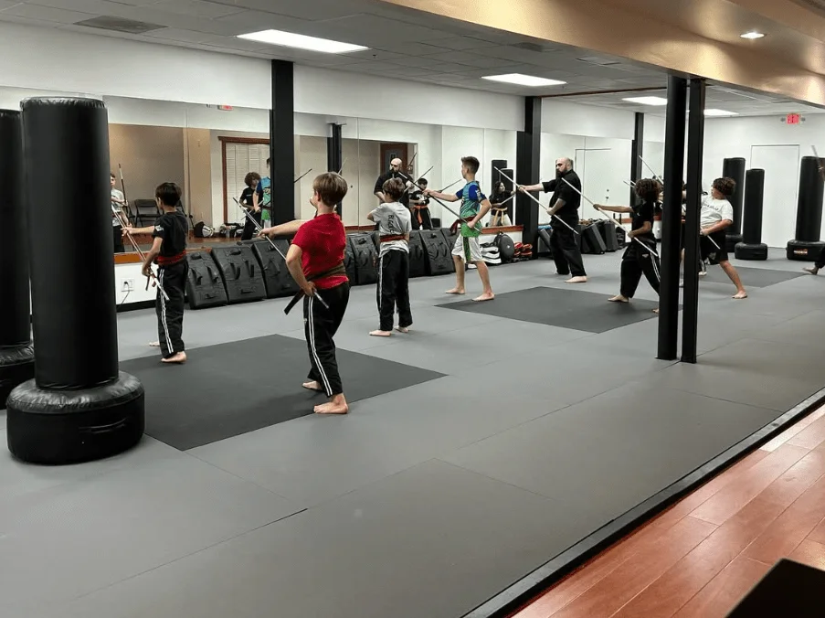 Ultimate Martial Arts Centers / Zuma Dojo academy logo